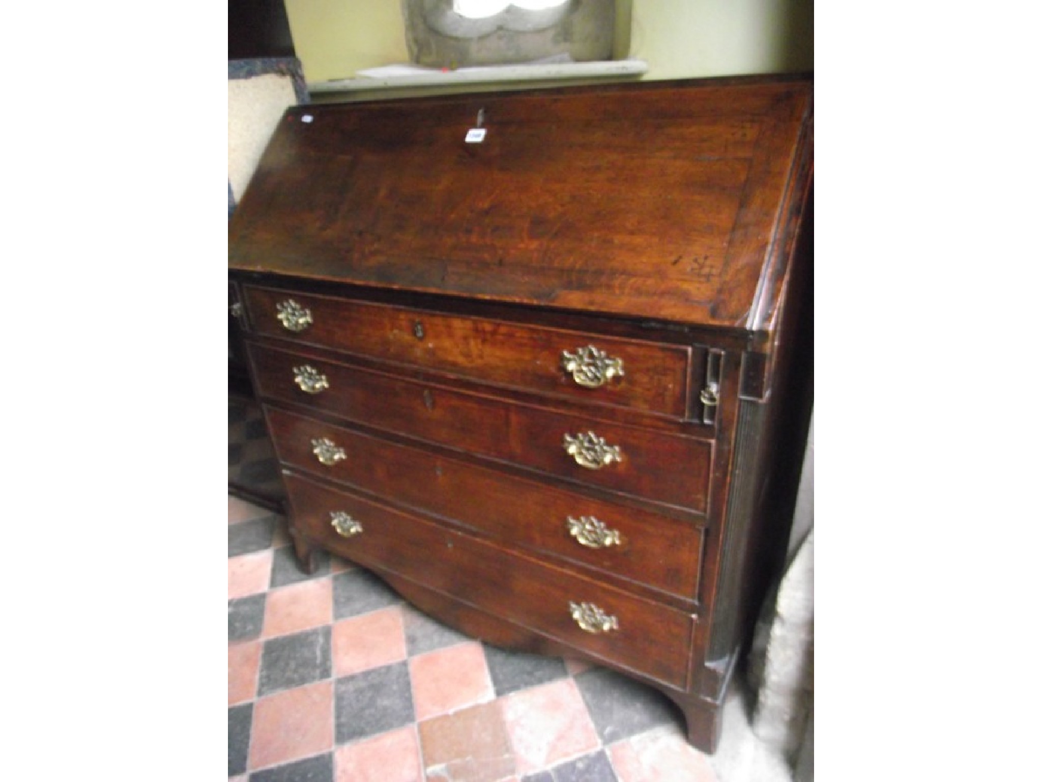 Appraisal: A Georgian oak country made bureau of four long drawers