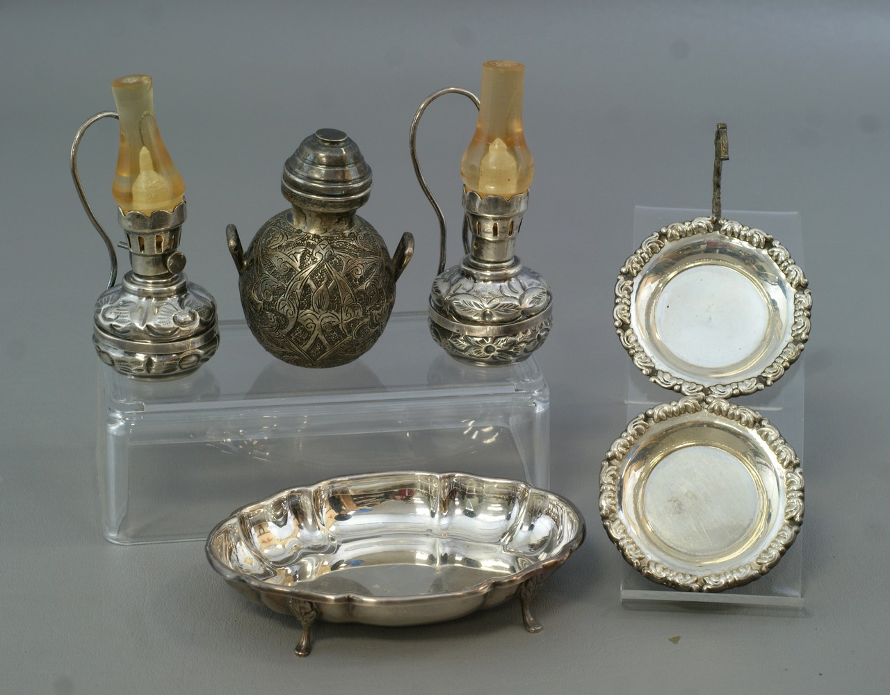 Appraisal: small silver Persian objects lamps covered jar butter pats small