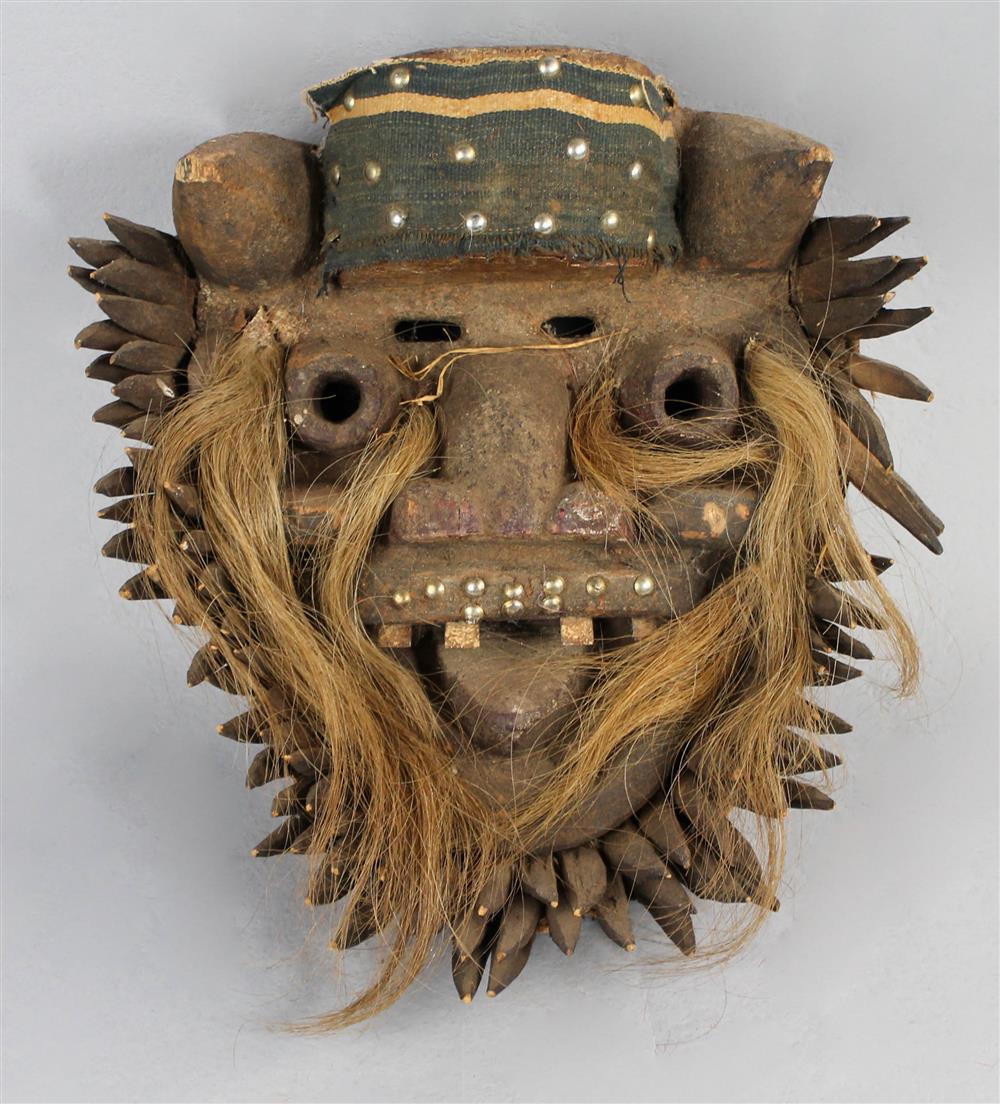 Appraisal: FOUR AFRICAN ZOOMORPHIC MASKS WITH A TIBETAN MASK the first