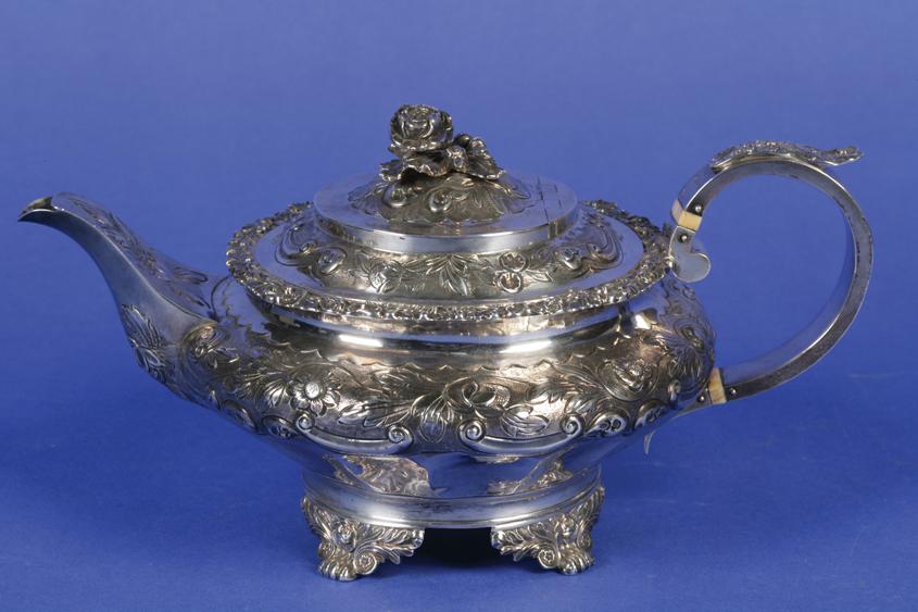 Appraisal: A GEORGE IV TEAPOT of compressed circular form the flush