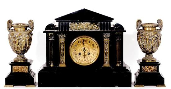 Appraisal: French three-piece black marble clock garniture circa architectural top over