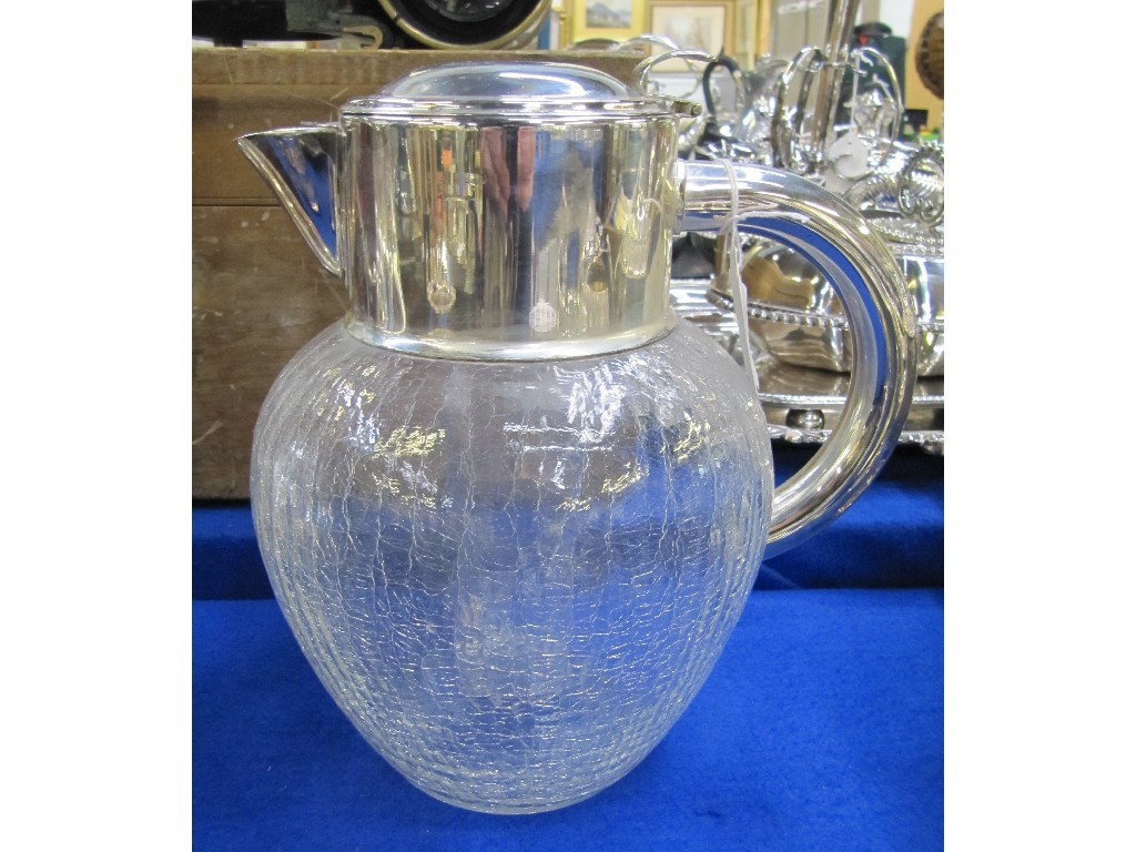 Appraisal: Silver plate and crackle glass ale jug