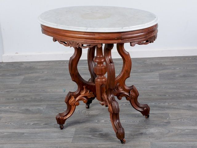 Appraisal: Eastlake Style Marble Top Parlor Table Eastlake style parlor table