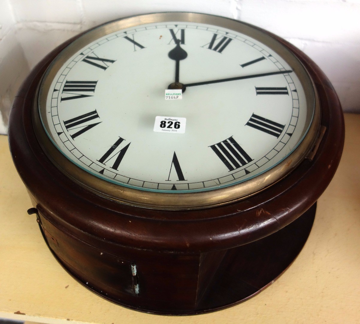 Appraisal: A mahogany cased double dialled wall clock early th century