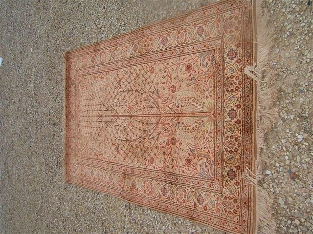 Appraisal: An Eastern beige ground wall hanging centrally decorated with a