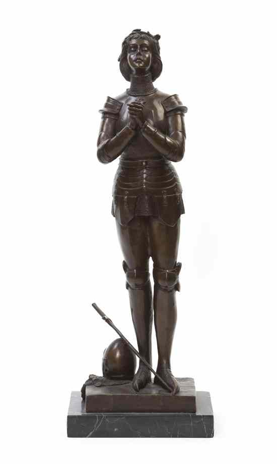 Appraisal: A Bronze Statue of Jeanne d'Arc depicted with hands clasped