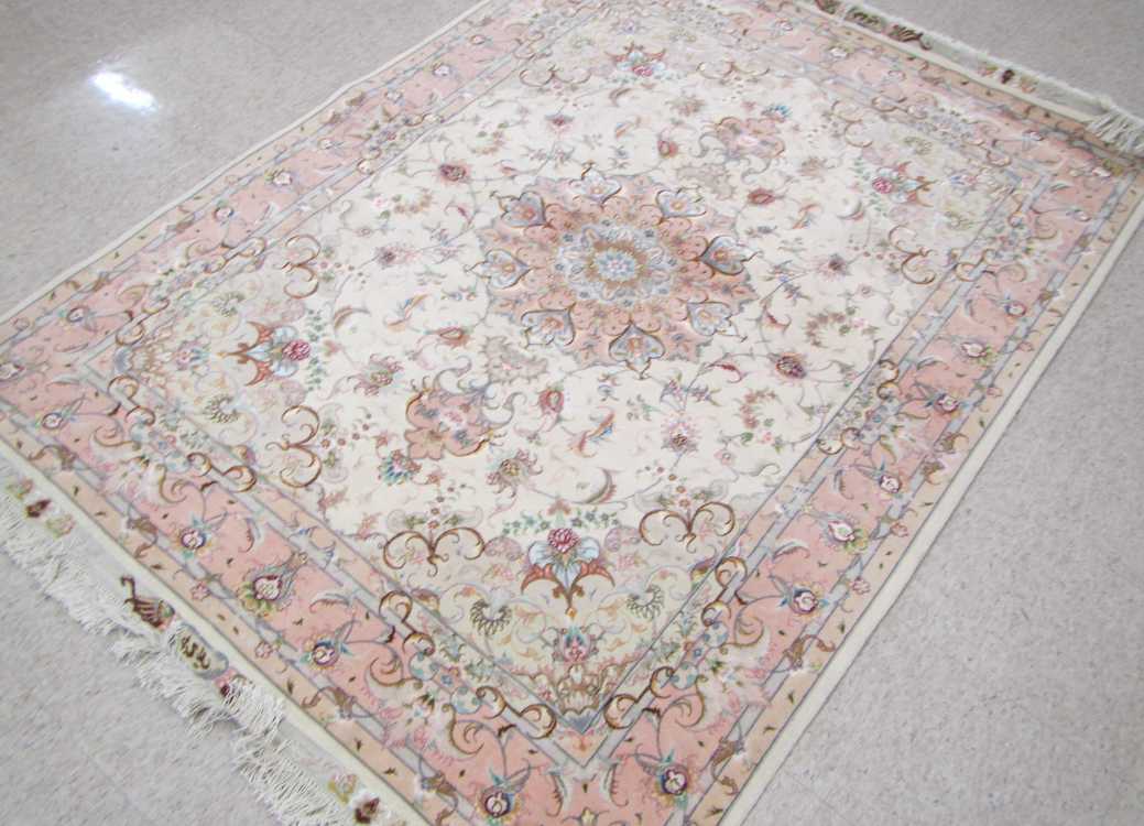 Appraisal: A CONTEMPORARY PERSIAN WOOL AND SILK CARPET floral and central