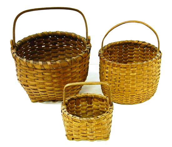 Appraisal: Three woven baskets one with flat arch handle '' h