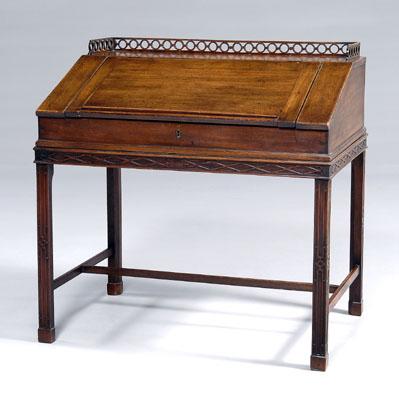 Appraisal: Chippendale mahogany desk on frame pierced gallery over hinged slant