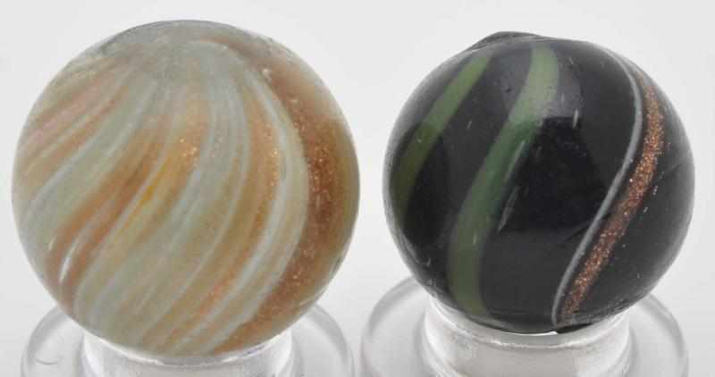 Appraisal: Lot of Lutz Marbles Description The larger marble is a