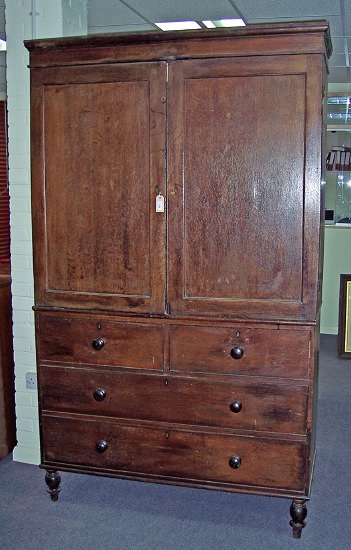 Appraisal: A th Century oak linen press enclosed by a pair