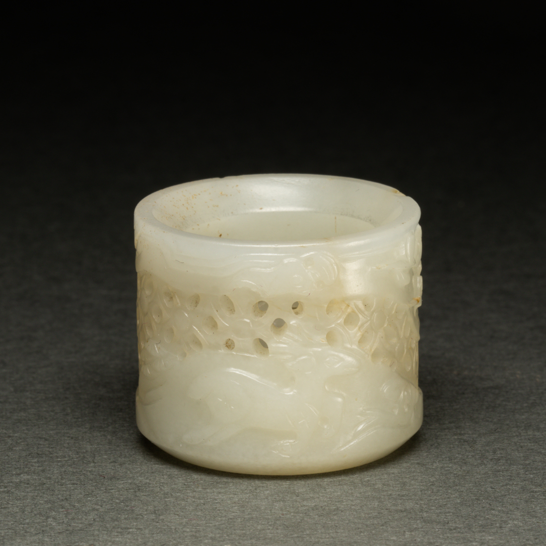 Appraisal: CHINESE WHITE JADE OPENWORK ARCHER'S RING Chinese white jade openwork