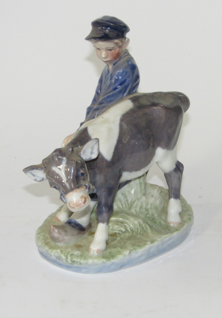 Appraisal: A Royal Copenhagen figure group of a young cow herder