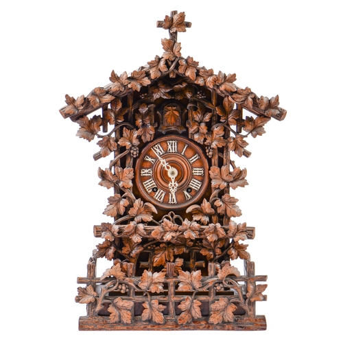 Appraisal: A Swiss walnut cuckoo clock late th c in the