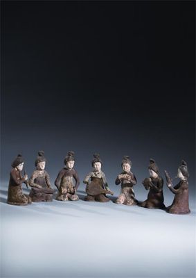 Appraisal: A set of seven Chinese unglazed and painted pottery models