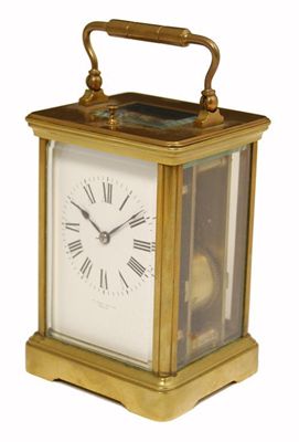 Appraisal: A French gilt brass corniche cased repeating carriage clock with