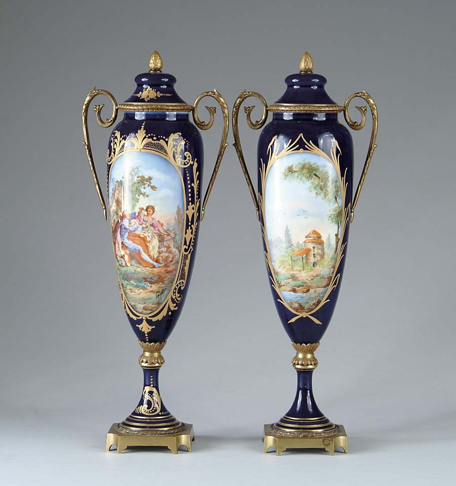 Appraisal: PAIR OF SEVRES URNS Lovely pair of dark blue urns