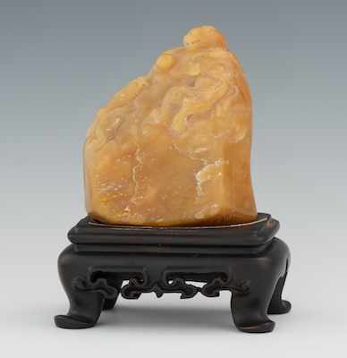 Appraisal: A Carved Hardstone of Two Lions at Play Caramel color