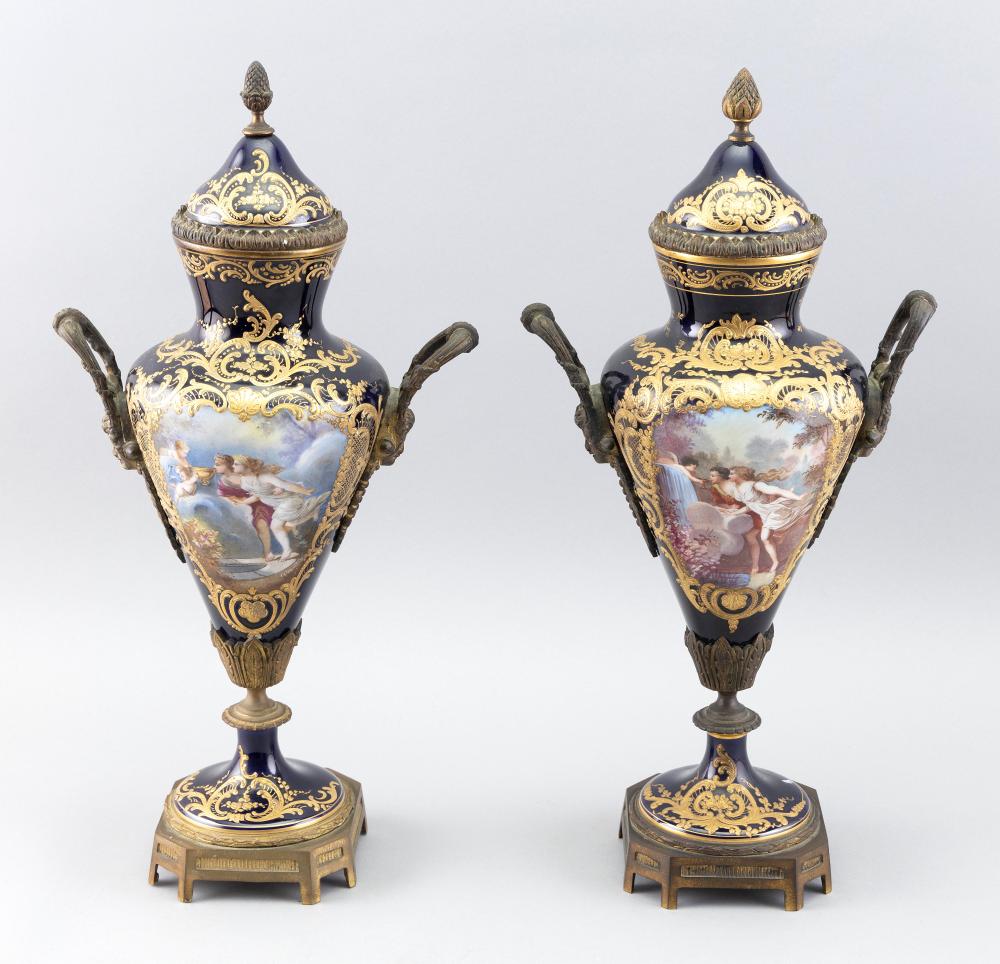 Appraisal: PAIR OF ORMOLU-MOUNTED S VRES COVERED URNS SIGNED QUENTIN LATE