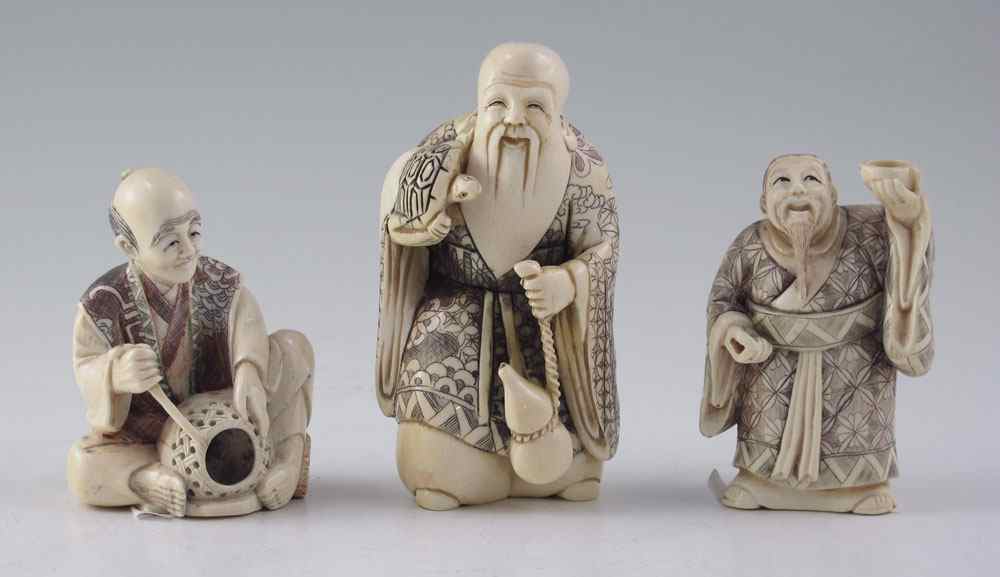 Appraisal: PIECE CARVED IVORY FIGURAL OKIMONO To include Elder with turtle