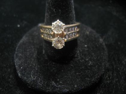 Appraisal: karat yellow gold doubled diamond channel set ring Two circular