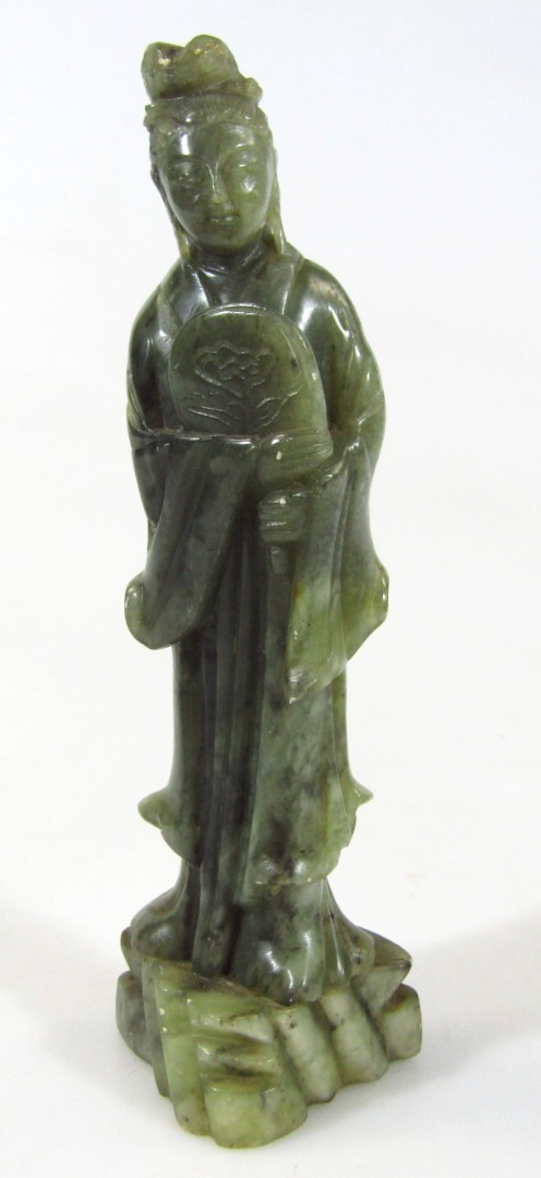 Appraisal: A thC Chinese green jade figure of a standing lady