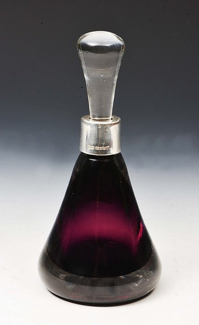 Appraisal: A PURPLE GLASS SCENT BOTTLE of tapering form with stylised