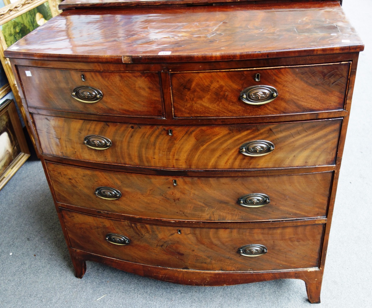 Appraisal: A George III bowfront mahogany chest of two short and