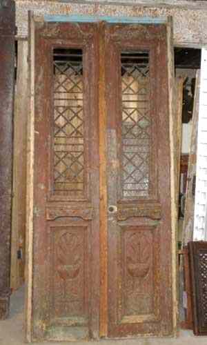 Appraisal: A French Colonial Carved Pine and Iron Panel Double Door