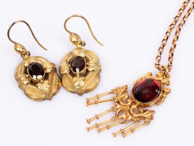 Appraisal: A garnet and ct gold pendant necklace on a ct