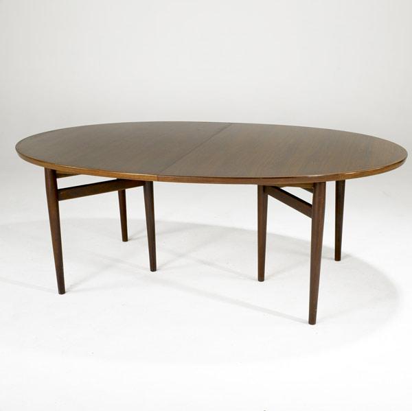 Appraisal: ARNE VODDER FOR SIBAST Rosewood oval dining table on tapered