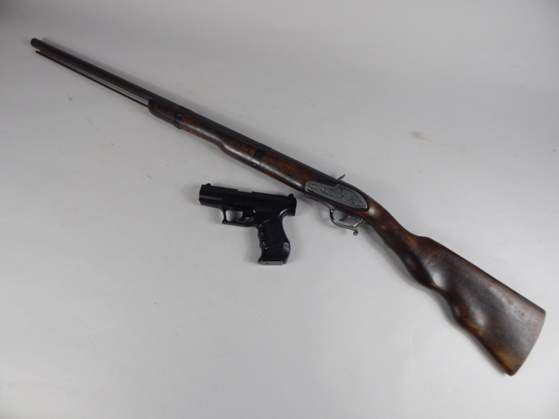 Appraisal: A KWL ball bearing gun and a reproduction musket