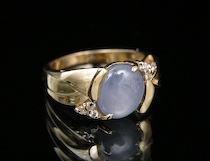 Appraisal: A Ladies' Ring Set with a Star Sapphire and Diamonds