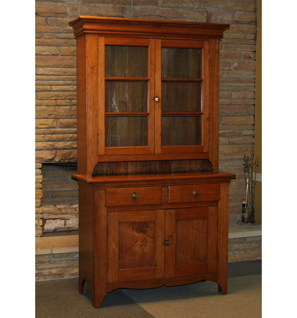 Appraisal: Primitive two-piece stepback wall cupboard mixed woods six light two