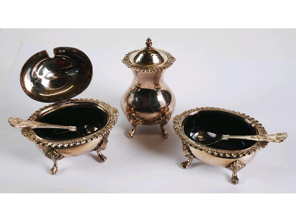 Appraisal: GEORGIAN STYLE THREE PIECE SILVER CONDIMENT SET with shell capped