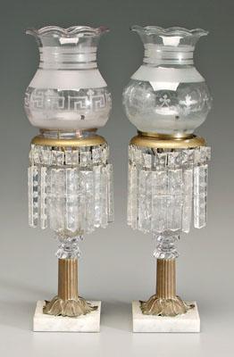 Appraisal: Pair clear glass fluid lamps domed font above tapered acanthus