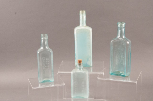 Appraisal: Assortment of Four Glass Bottles Including Clark Chemists Dr Pierce's