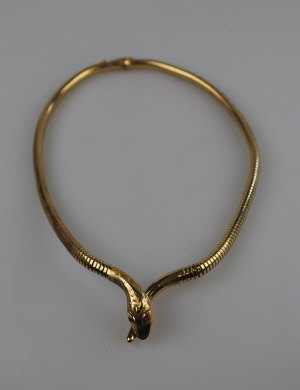 Appraisal: ct yellow gold articulated snake-style necklace having red stone eyes