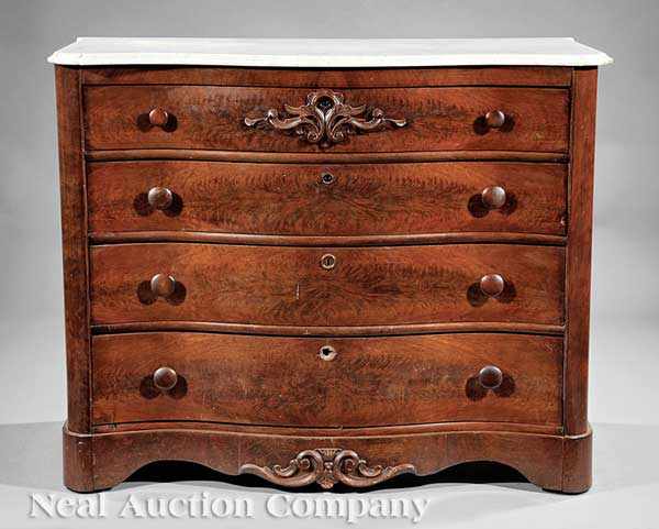 Appraisal: An American Rococo Carved Mahogany Chest of Drawers mid- th