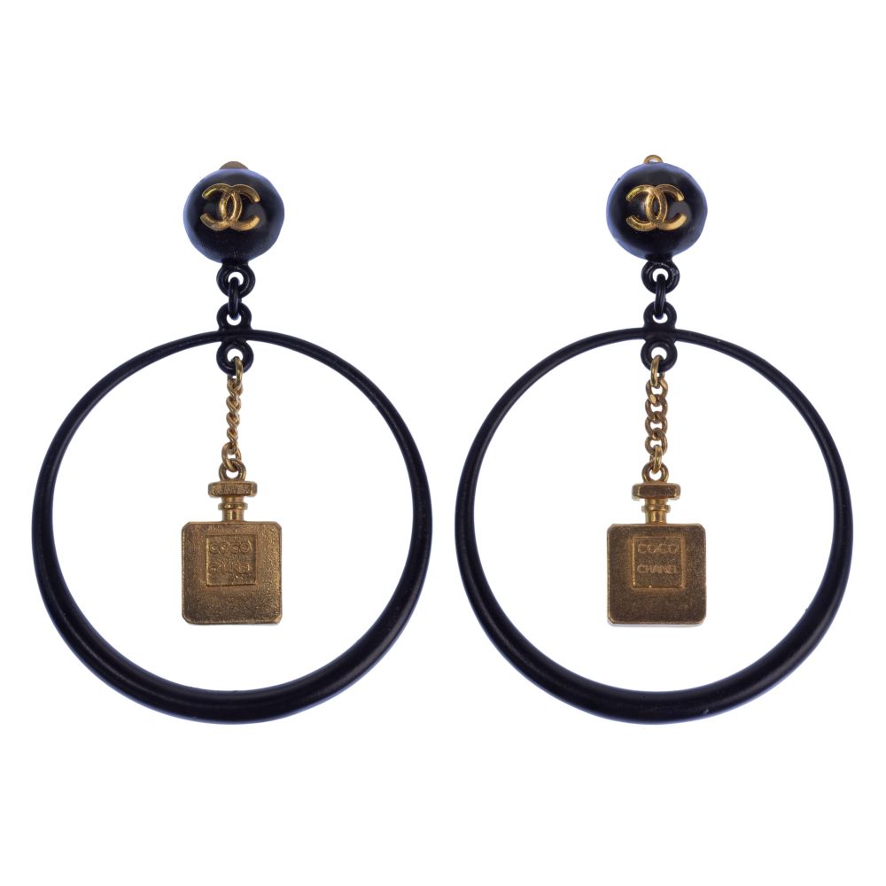 Appraisal: COCO CHANEL CLIP-ON EARRINGSButton earrings with hoop drop and bottle-shaped