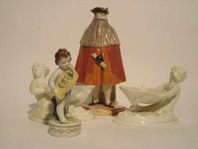 Appraisal: Four European glazed ceramic figures Comprising a pair of Royal