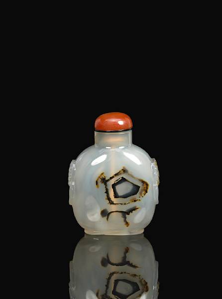 Appraisal: A shadow agate bottle on grey ground with geometric forms