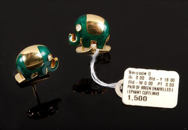 Appraisal: A pair of green enamel and diamond cufflinks designed as