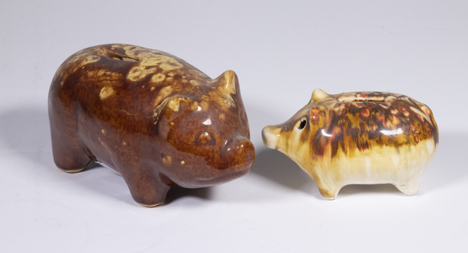 Appraisal: BROWN GLAZED PIGGY BANKS Lot of Pig Form Banks with