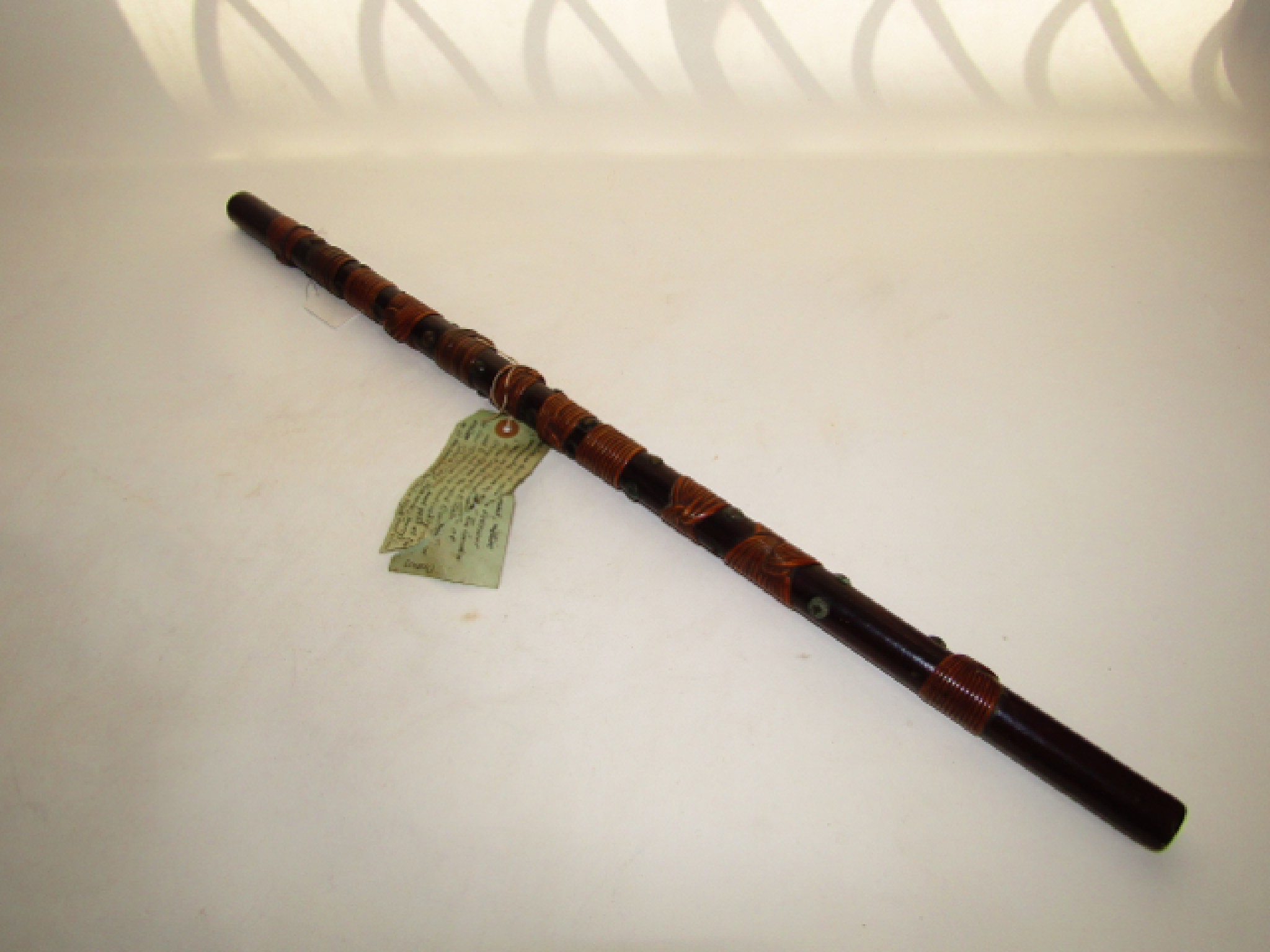 Appraisal: An antique Indian swagger stick with woven wicker collars and