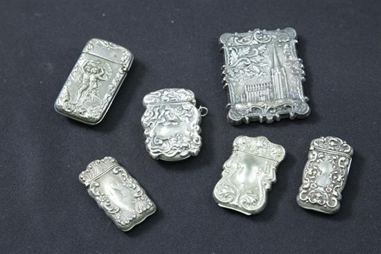 Appraisal: SIX MATCH SAFES Including a profusely decorated match safe depicting