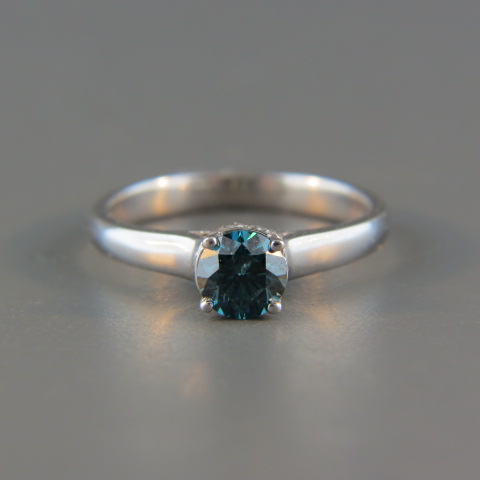 Appraisal: Blue Diamond Ring carat roundwith round diamonds surrounding it K