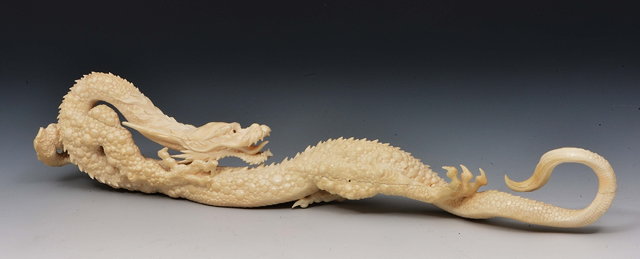 Appraisal: A Japanese ivory okimono of a dragonMeiji periodsigned Toshio Chika