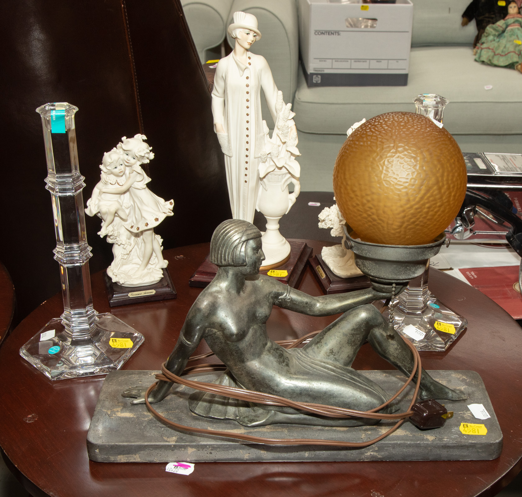 Appraisal: ASSORTMENT OF DECORATIVE ITEMS Includes three Armani figures to in