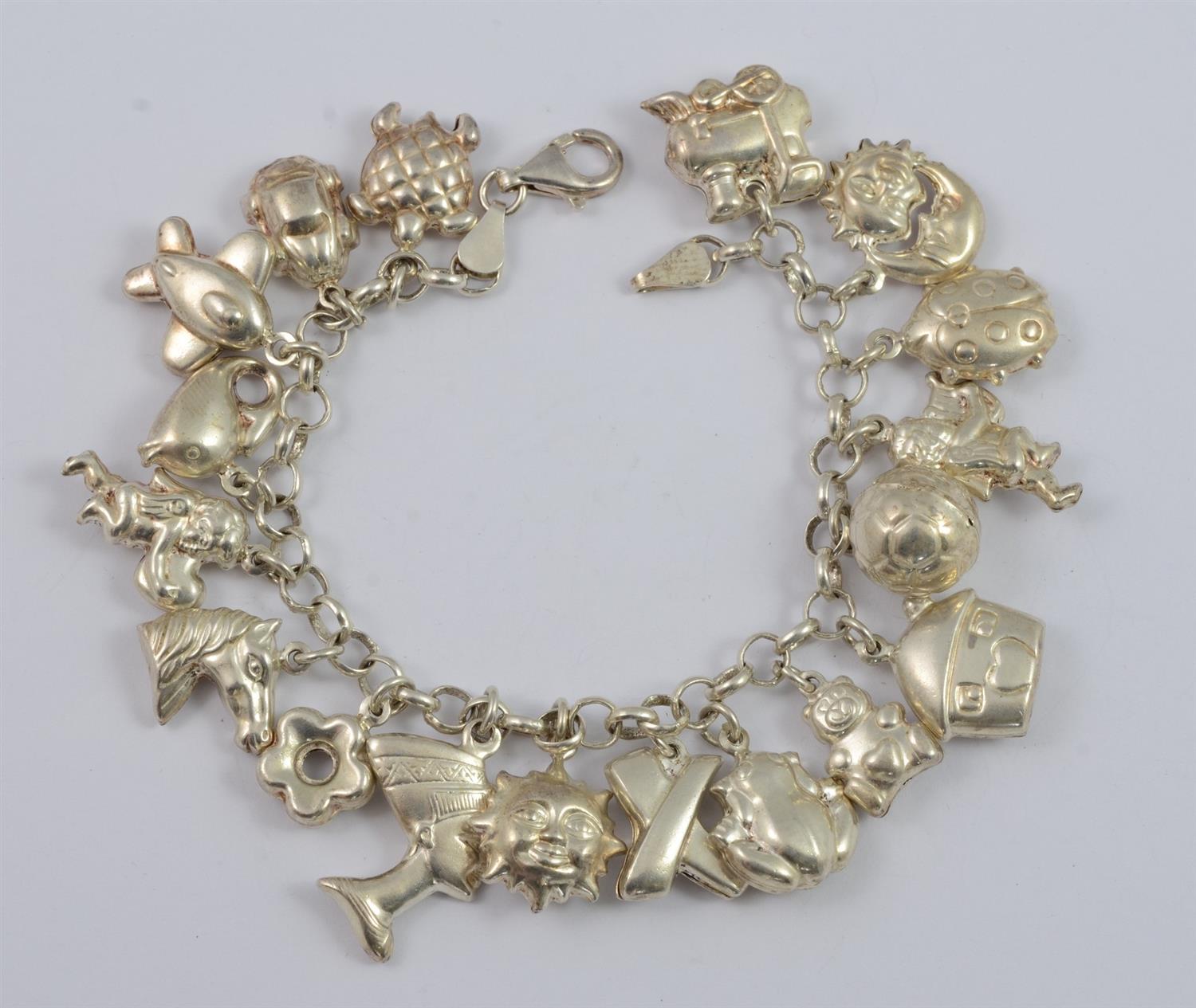 Appraisal: Sterling silver charm bracelet unmarked charms TO